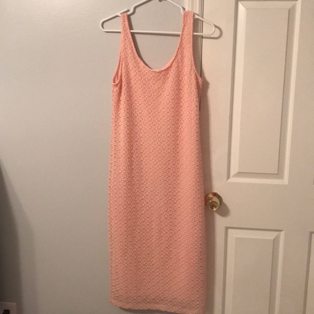 Form-fitting long, comfortable sleeveless dress.